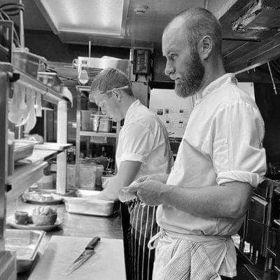 Oliver working the kitchen pass at Harbour Kitchen